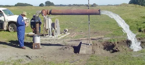 Pump test in progress, discharging water from a bore for flow measurement