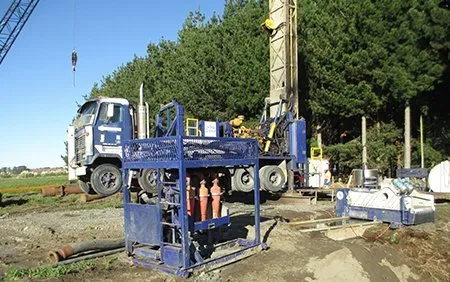 WellDrillers rotary mud drilling rig set up over a bore on a rural Whanganui site
