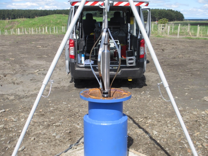 camera2 Downhole camera on a tripod being lowered into a blue bore headworks casing